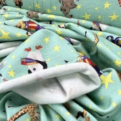 Licensed Jersey - Madagascar Circus -Croft Mill cotton elastane jersey fabric licensed madagascar aqua circus print cu