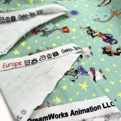 Licensed Jersey - Madagascar Circus -Croft Mill cotton elastane jersey fabric licensed madagascar aqua circus print fold