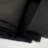JK - Marmaris - Black 1 JK - Marmaris - Black -Croft Mill jk mamaris black cotton stretch twilled trousering dress fabric close up fabric photo