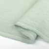Pure Linen - Mint -Croft Mill pure linen mint 100 plain dyed linen suiting fabric close up fabric photo