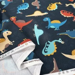 Stof Cotton Jersey - Chompers -Croft Mill stof cotton jersey chompers dinosaur print navy oeko tex elastane knitted fabric fold